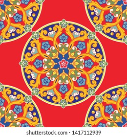 Seamless pattern background. Colorful ethnic round ornamental mandala on red. Bright texture. Vector illustration.