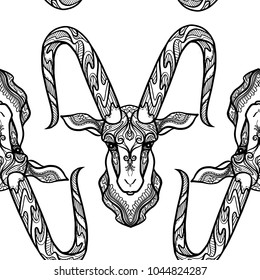 Seamless pattern, background with ethnic patterned ornate hand drawn head of Capricorn, goat outline on white background . 