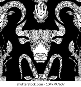 Seamless pattern, background with ethnic patterned ornate hand drawn head of goat, bull, ox, cancer, sheep, ram white on black background . 