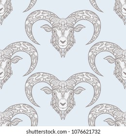 Seamless pattern, background with ethnic patterned ornate hand drawn head of Aries, sheep, ram. On blue vintage  background. 