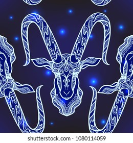 Seamless pattern, background with ethnic patterned ornate hand drawn head of Capricorn, goat/  On dark blue spase background with stars. 