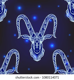 Seamless pattern, background with ethnic patterned ornate hand drawn head of Capricorn, goat/  On dark blue spase background with stars. 