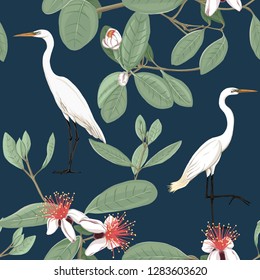 Seamless pattern, background with floral pattern with feijoa blooming flowers and herons. Vector illustration without gradients and transparency.  On dark blue background.