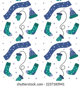 Seamless pattern background knit clothes socks gloves scarf. Hand drawn vector wallpaper and Christmas paper design