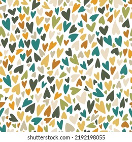 seamless pattern background with many small hand drawn doodle hearts. Cute autumn fall warm earthy color palette backdrop. Romantic naive neutral textile print design