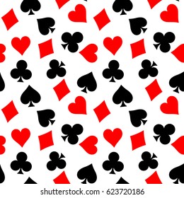 Seamless pattern background of poker suits - hearts, clubs, spades and diamonds - on white background. Casino gambling theme vector illustration.