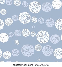 Seamless pattern, background, surface design with the image of lace snowflakes for wallpaper, fabric, wrapper, background
