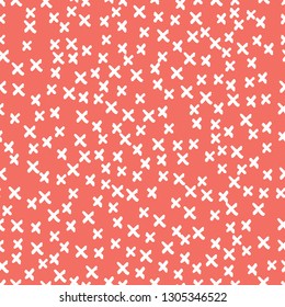 Seamless pattern background in trendy color of 2019, coral colour, endless hand drawing abstract doodle of crosses or stars, snowflakes or snow, this year. Vector.