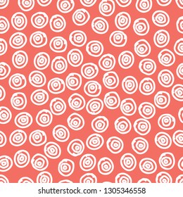 Seamless pattern background in trendy color of 2019, coral colour, endless hand drawing abstract doodle of dots or circles, ovals, bubbles or snow, this year. Vector.
