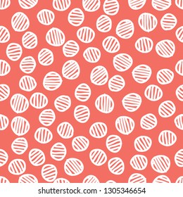 Seamless pattern background in trendy color of 2019, coral colour, endless hand drawing abstract doodle of dots or circles, ovals, bubbles or snow, this year. Vector.