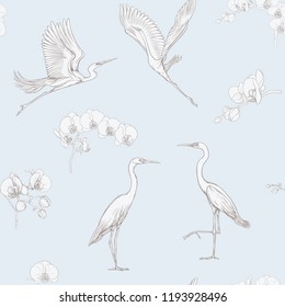 Seamless pattern, background with tropical birds. White heron,cockatoo parrot. Vector illustration. Graphic drawing, engraving style. vector illustration. In vintage blue and beige colors.
