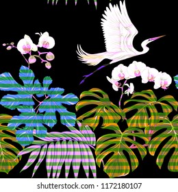 Seamless pattern, background. with tropical plants and flowers with white orchid and tropical birds. Colored vector illustration in neon, fluorescent colors on black,  background with stripes
