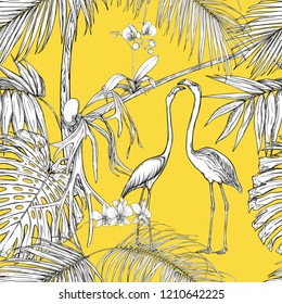 Seamless pattern, background. with tropical plants and flowers with white orchid and tropical birds. Graphic drawing, engraving style. vector illustration. Black and white on yellow background.