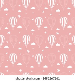 Seamless pattern of balloons stars and clouds on a pink background