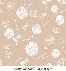 Seamless pattern with balls of thread and yarn, knitting needles ,crochet hooks. Endless texture with white elements on a beige gray background. For knit hobby, design, shop of yarn and handmade.