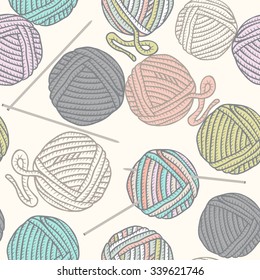Seamless pattern with balls of yarn and knitting needles. Background in cartoon style.