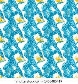 Seamless pattern with banana and areca palm leaves and bird of paradise flowers.