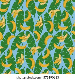 Seamless pattern of bananas and green leaves on blue. Tropical wallpaper, textile print, exotic background.