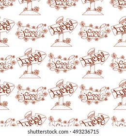 Seamless pattern with a banner and a pointer, sign of good luck.