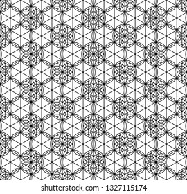 Seamless pattern based on Japanese geometric ornament.Black and white silhouette.Compound ornament.Average thickness lines.Hexagon grid.