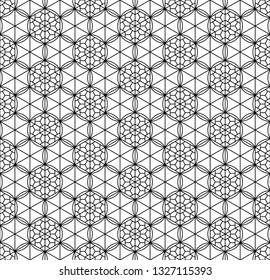 Seamless pattern based on Japanese geometric ornament.Black and white silhouette.Compound ornament.Average thickness lines.Hexagon grid.