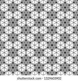 Seamless pattern based on Japanese geometric ornament.Black and white silhouette.Compound ornament.Average thickness lines.Hexagon grid.
