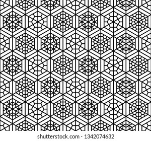 Seamless pattern based on Japanese geometric ornament.Black and white silhouette.Compound ornament.Hexagon grid.