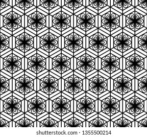 Seamless pattern based on Japanese geometric ornament.Black and white silhouette.Compound ornament.Hexagon grid.