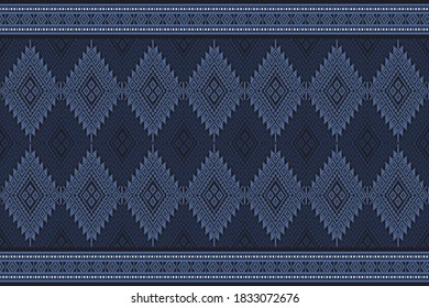 Seamless pattern based on Tai Lue tribal embroidery pattern. Indigo and light blue tone color stitch on midnight blue background. Idea for paper, cover, fabric, interior decor and other users.
