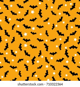 Seamless pattern with bats flying in the orange sky and white stars. Halloween background.