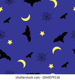 Seamless pattern with bats. moons,  stars  and spider net on dark blue background.