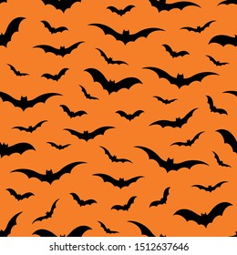 Seamless pattern with bats on orange background, vector illustration