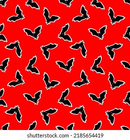  patrón impecable con murciélagos en un fondo rojo. ilustración vectorial. diseño para Halloween 