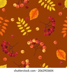 Seamless pattern with beautiful autumn leaves and rowan berries on a bright background, vector