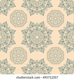 Seamless pattern with beautiful blue mandalas on the light pink background. Vector background