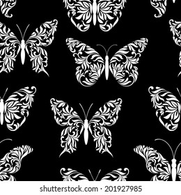Seamless pattern with beautiful butterflies on a black background