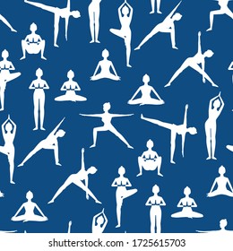 Seamless pattern with beautiful girls doing yoga poses white silhouettes. On blue background