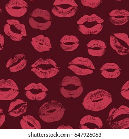Seamless pattern with beautiful pink color lips prints on dark background.
