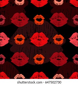 Seamless pattern with beautiful red and pink colors lips prints on black background.