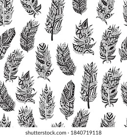 Seamless pattern of beautiful tribal feathers. Ethnic design of background of the feathers of birds. Black and white vector illustration.