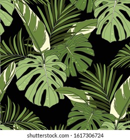 Seamless pattern. Beautiful vintage black background. Tropical exotic leaves. Wallpaper baroque. Drawing engraving. 