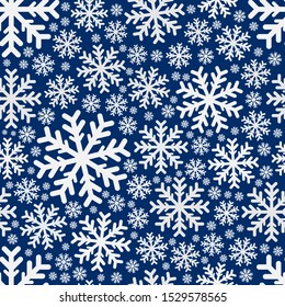 Seamless pattern. Beautiful white snowflakes isolated on a blue background. Vector drawing. Texture.