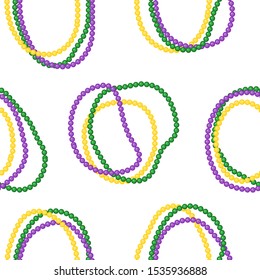 Seamless pattern beautiful yellow, green, purple beads on a white background. Mardi Gras Party. Venetian carnival mardi gras party.  Vector Design with carnival symbol 