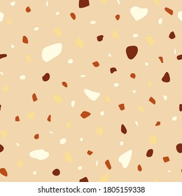 Seamless pattern in beige colors. Nut crumb, mosaic and terrazzo texture. Can be used for decor, textiles, fabrics, packaging, wrapping paper, wallpaper, design, printing.