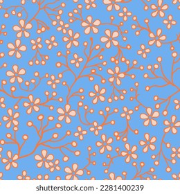 Seamless pattern of beige flowers and orange contour branches. On a blue background.