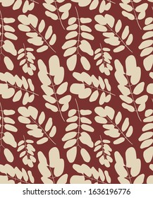 Seamless pattern. Beige leaves on a red background.