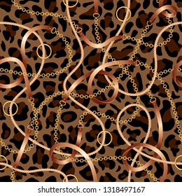 Seamless pattern with belts, chains and rope on leopard skin background