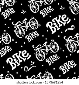 Seamless pattern with bicycle illustration and lettering  of word Bike. On an isolated black background. great print for fabric and bedding.