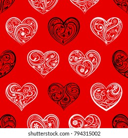 Seamless pattern of big hearts with ornament of curls, flowers and leaves, white and black on red