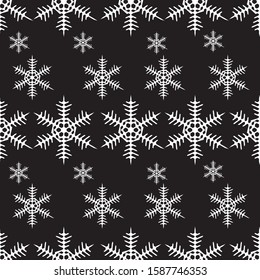 Seamless pattern of big and little white snowflakes on a black background. Vector EPS. Gift Christmas paper, christmas textiles. Christmas design and decoration.